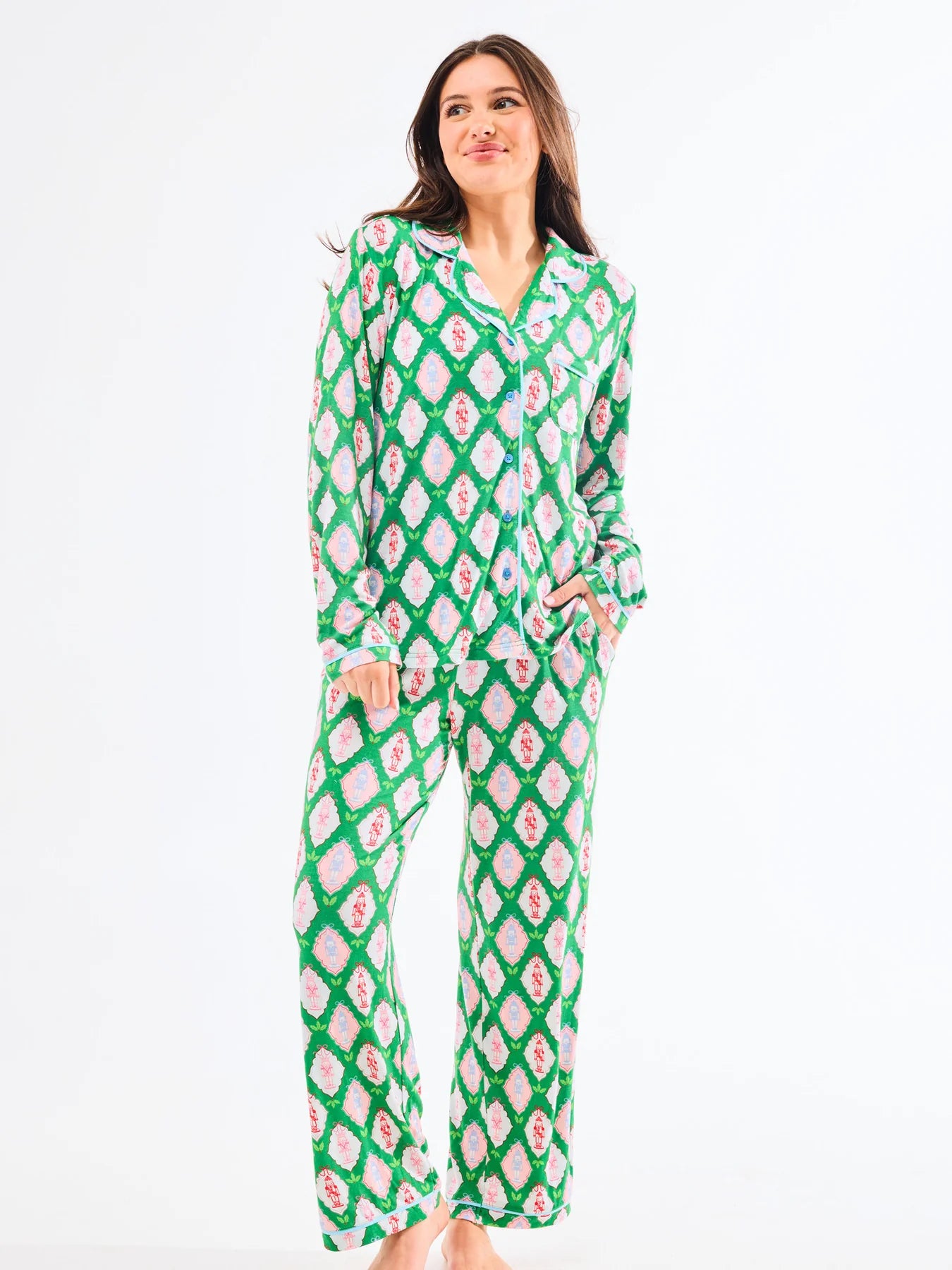 woman in Christmas-themed pink and green Mary Square pajamas from women's clothing boutique The Dadgum Debutante Boutique