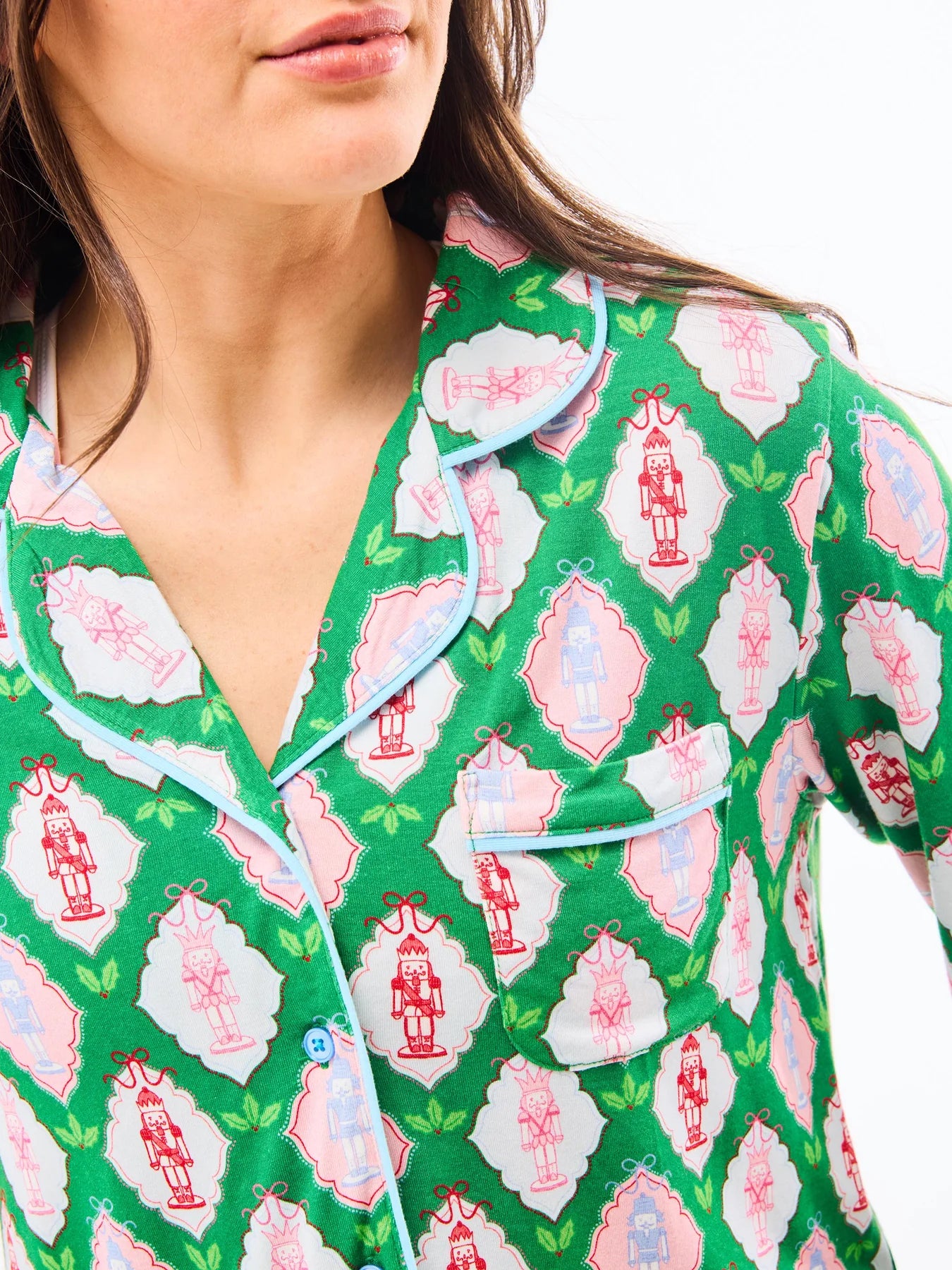 woman in Christmas-themed pink and green Mary Square pajamas from women's clothing boutique The Dadgum Debutante Boutique
