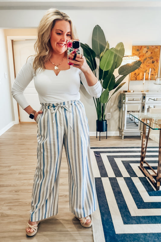 Blue and white striped wide leg linen pants from an online boutique for women.