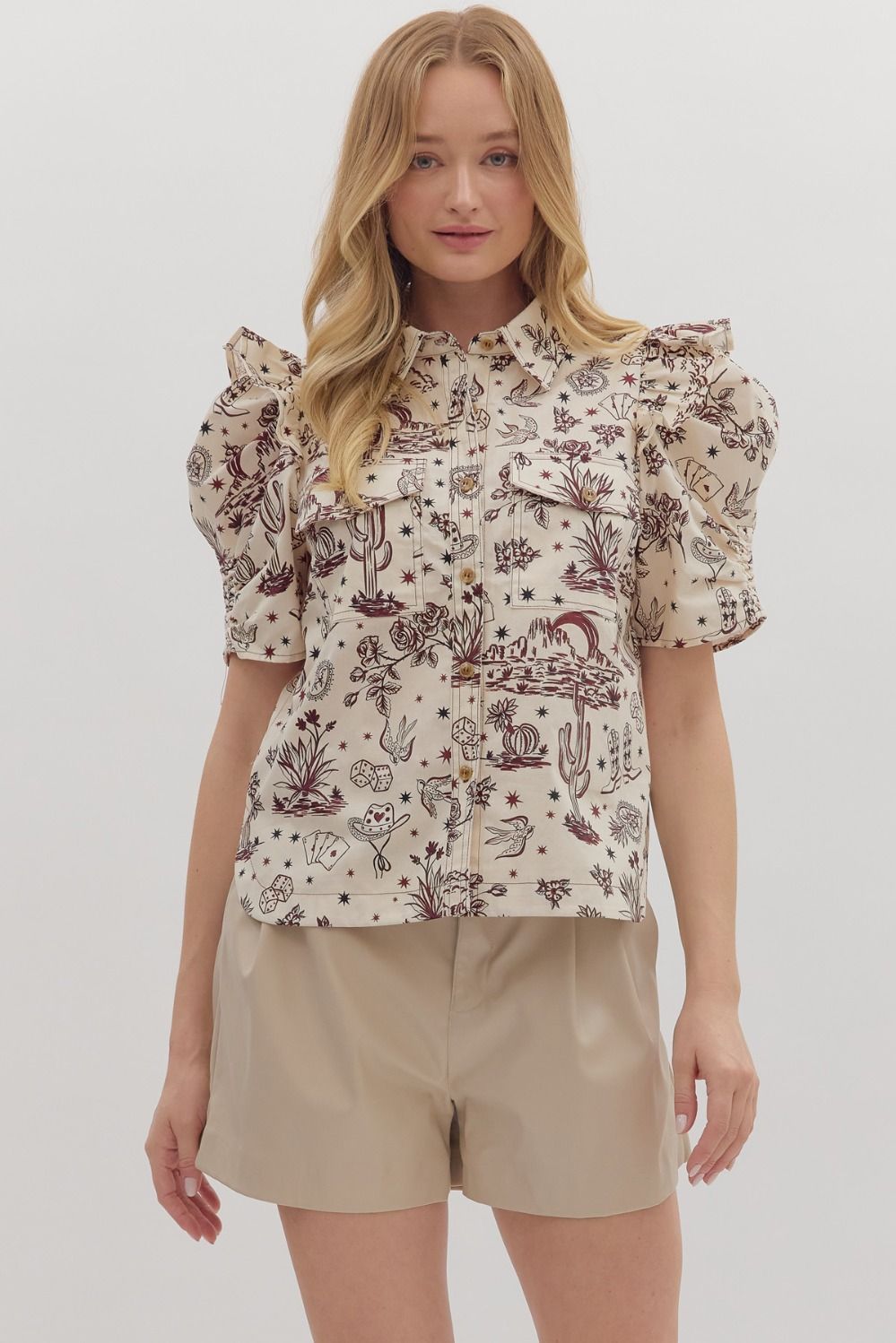 western-themed denim blouse with puff sleeves, pocket and collar detaiiling, buttons down the front from women's clothing boutique The Dadgum Debutante Boutique.