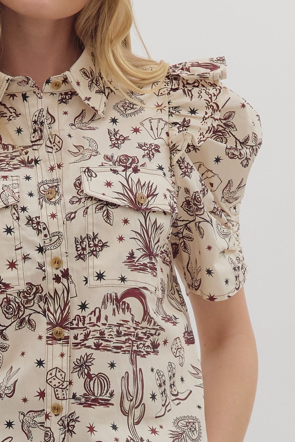 western-themed denim blouse with puff sleeves, pocket and collar detaiiling, buttons down the front from women's clothing boutique The Dadgum Debutante Boutique.