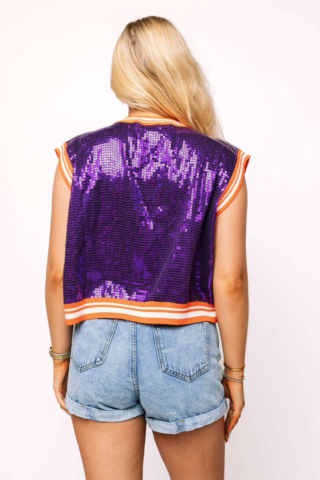 Purple sequin tank featuring Clemson Tiger paw print in orange from brand Queen of Sparkles, found at women's clothing boutique The Dadgum Debutante Boutique