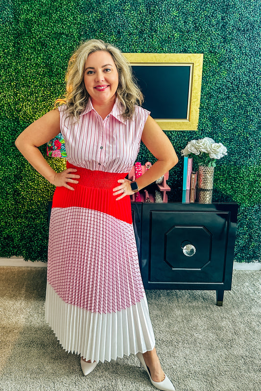 Red and white striped dress with pleated skirt, featuring a solid, bright red waistband and a solid white hemline from women's clothing boutique The Dadgum Debutante Boutique