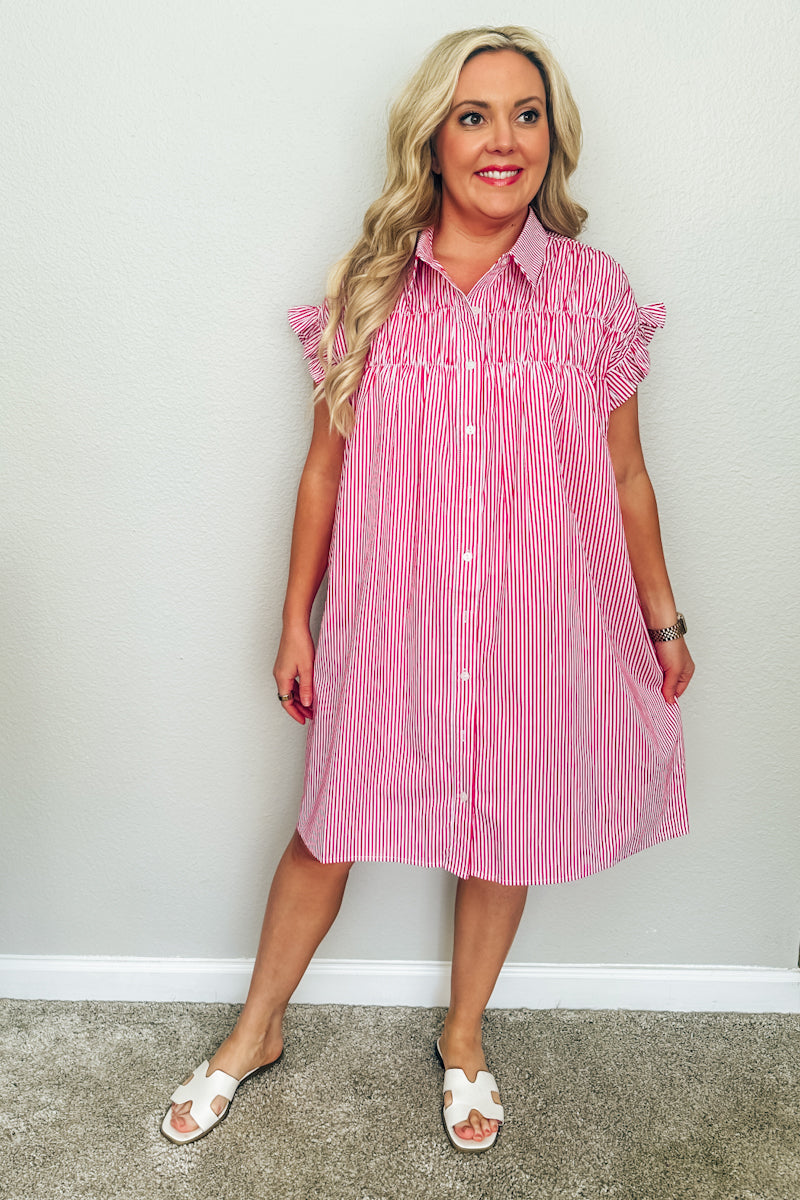 The Lexington Shirtdress in red and white stripes. Picture showcases the breezy silhouette, casual Southern style aesthetic, and preppy clothing from The Dadgum Debutante Boutique.