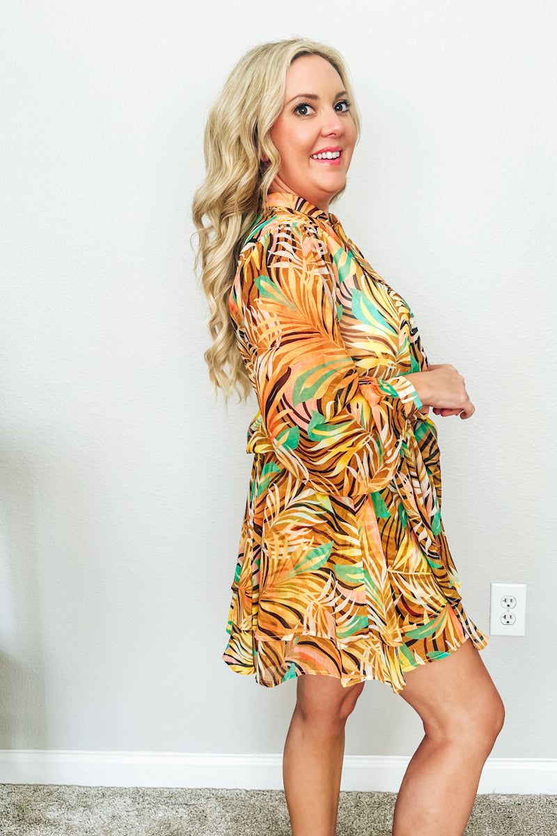 Woman high-waisted tropical print shorts as part of a matching resort wear set. 